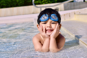 A child sitting in a pool