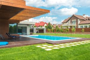  View of a bungalow backyard with a pool