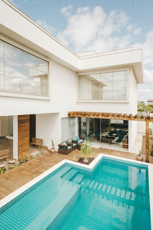 Outdoor living space of a house designed by a pool designer in South Riding