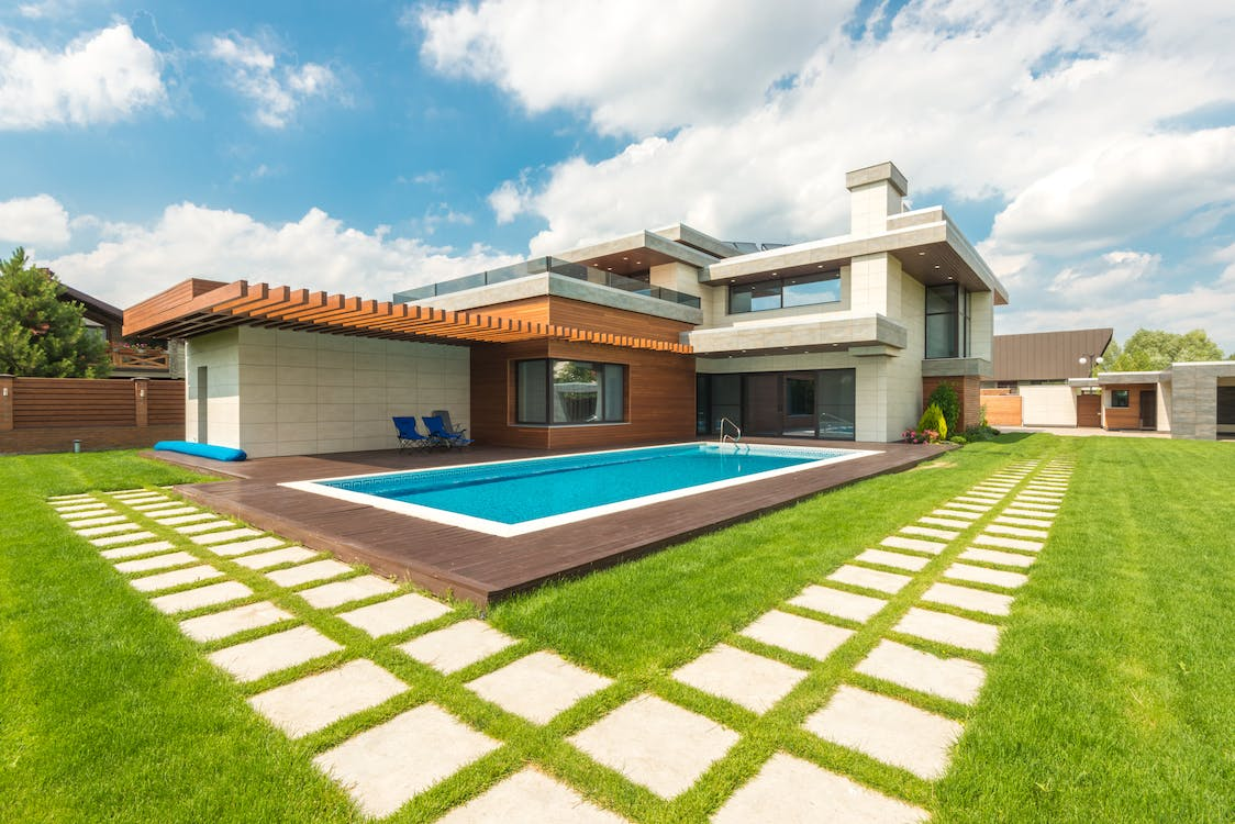 An outdoor walkway and swimming pool built by a landscape designer in Leesburg, South Riding, Purcellville